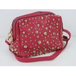 An 'as new' pink studded handbag handbag