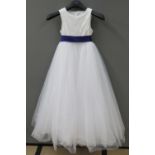 A flower girl dress with purple sash and tulle skirt by David Bridal, age 8.