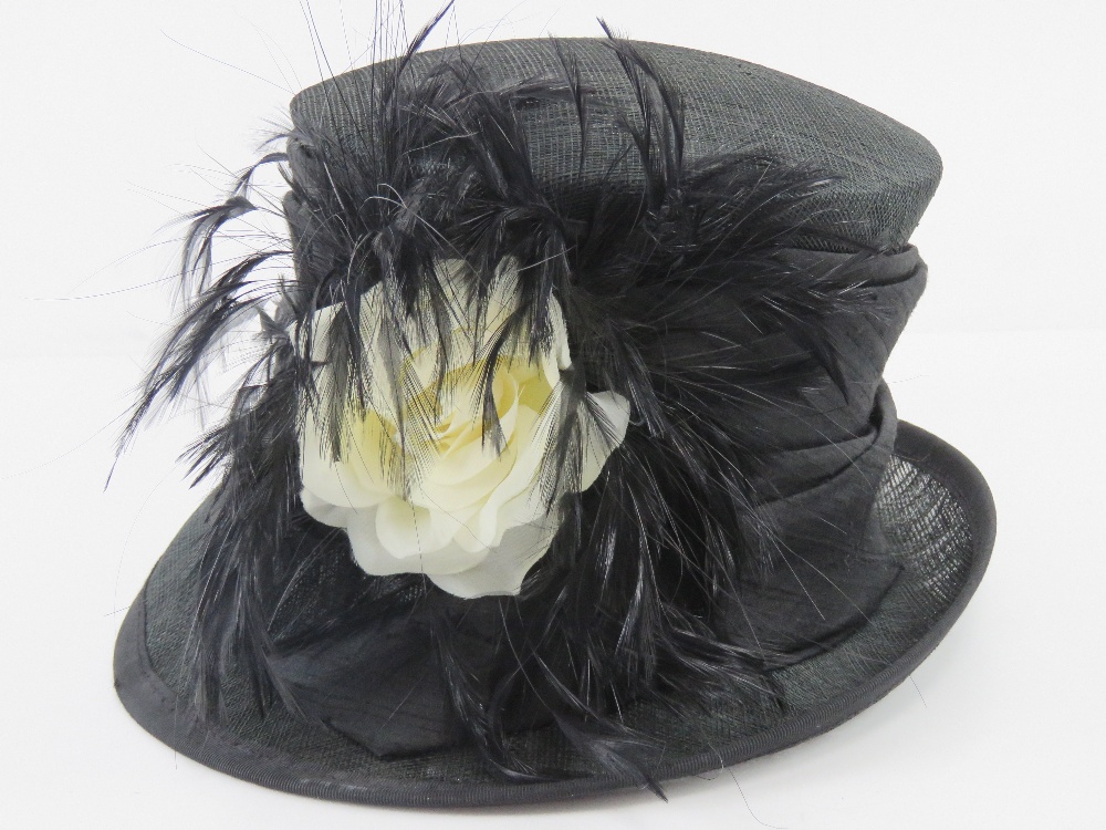 A Victoria Ann natural fibre hat having