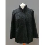 A black curly Persian lambs wool jacket, approx measurements - 43" chest, 29" length to back,