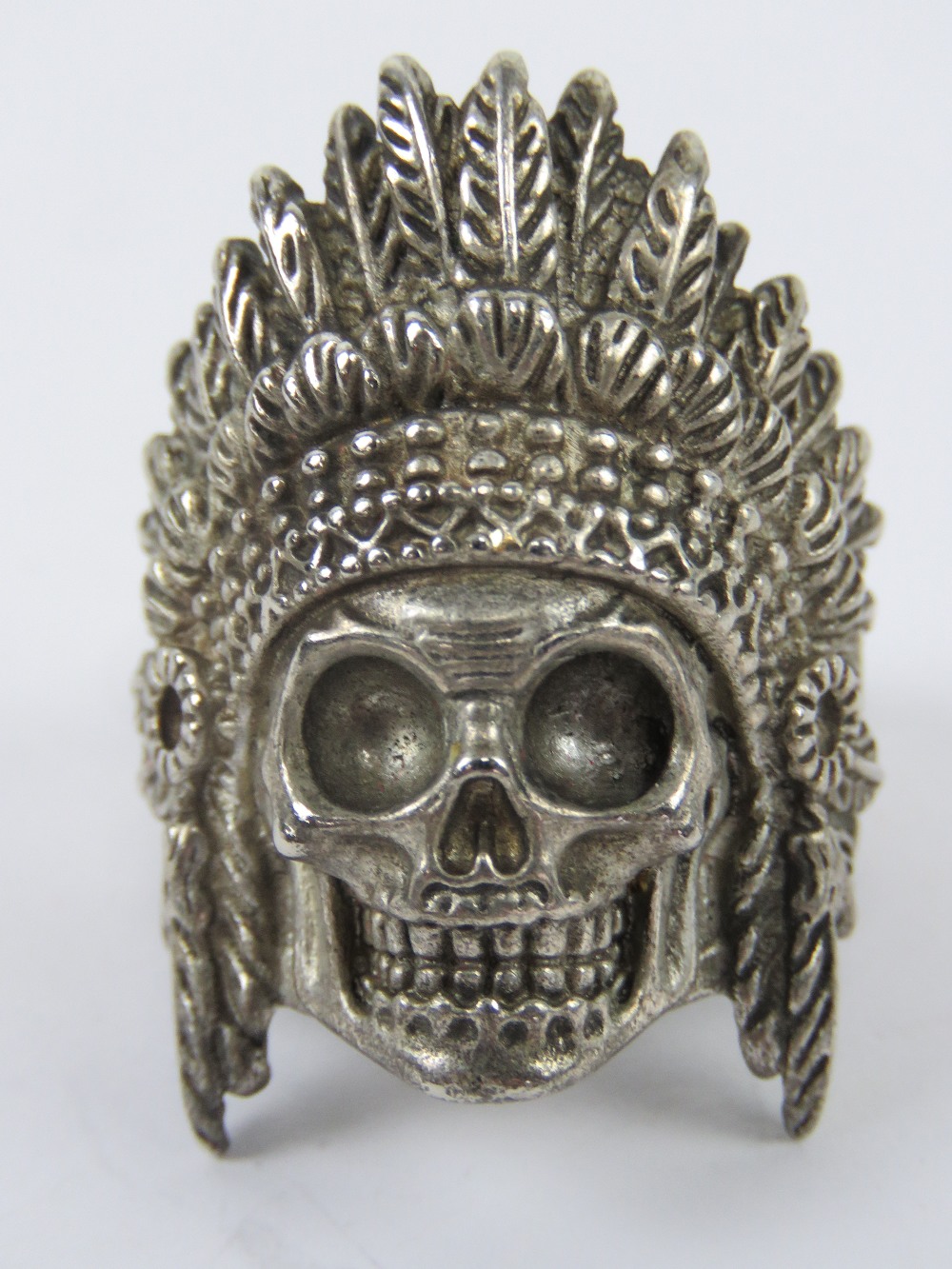 A white metal ring having skull in Nativ