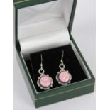 A pair of silver and pink opal earrings,