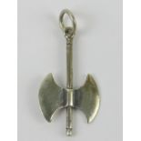 A silver pendant in the form of a battle