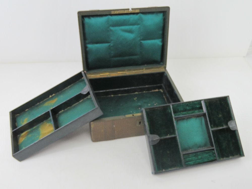 An antique jewellery box having two fitt