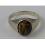 A silver tigers eye cabachon ring, stamp
