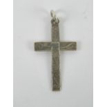 A silver crucifix pendant having scrolli