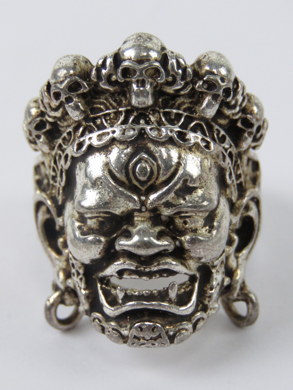 An Asian Death God ring having skull cro