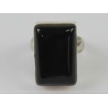 An onyx ring, the rectangular cabachon s