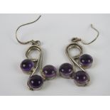 A pair of silver amethyst earrings each
