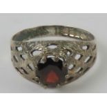 A HM silver red stone ring, pierced latt