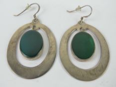 A pair of large green stone and silver e