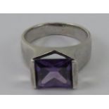 A silver and amethyst ring, rectangular