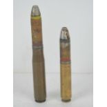 Two inert German 20mm shells, having markings upon.