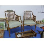 A PAIR OF NEOCLASSICAL STYLE PAINTED SATINWOOD ARMCHAIRS, THE TOP RAILS PAINTED WITH VILLAGE