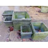 FIVE BLACK SQUARE PLANTERS.