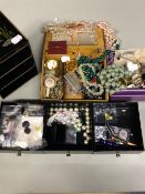 A LARGE COLLECTION OF VINTAGE COSTUME JEWELLERY CONTAINED IN TWO JEWELLERY CASES.