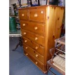 A TALL PINE CHEST OF DRAWERS.