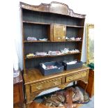 AN ANTIQUE WALNUT CROSS BANDED DRESSER, WITH ASSOCIATED PLATE RACK STANDING ON CABRIOLE LEGS.
