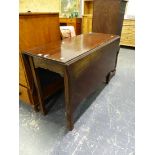 AN ANTIQUE MAHOGANY DROP LEAF DINING TABLE OF SHAPED OUTLINE.