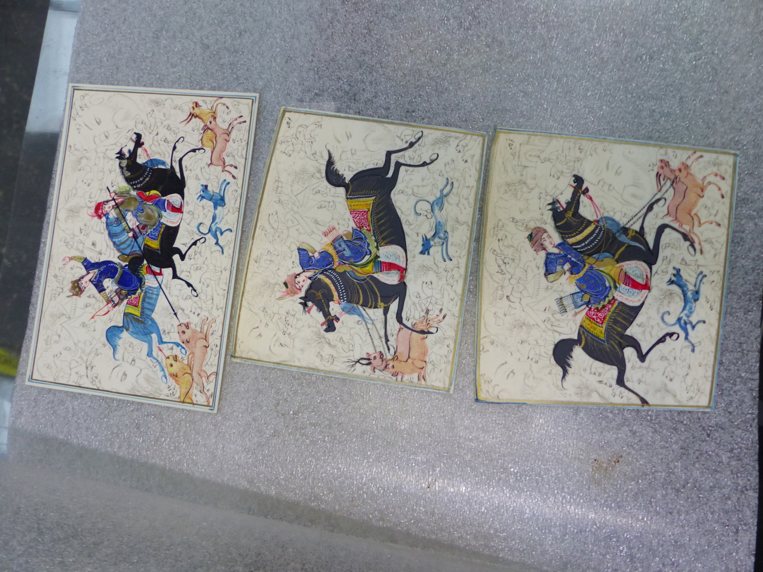 A GROUP OF THREE EASTERN MINIATURE PAINTINGS, HUNT SCENES.