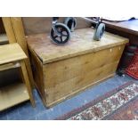 A LARGE ANTIQUE PINE BLANKET BOX.