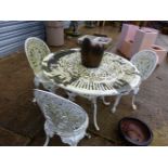 A WHITE PAINTED ALLOY PATIO TABLE AND THREE CHAIRS