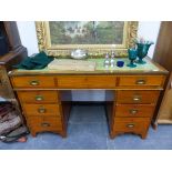 AN ANTIQUE MAHOGANY AND BRASS BOUND CAMPAIGN TYPE PEDESTAL DESK.