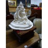 A VICTORIAN ROSE WOOD FOOT STOOL, AND A CARVED WALL BRACKET.