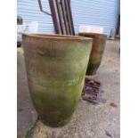 A PAIR OF TALL TERRACOTTA PLANTERS