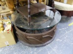 AN UNUSUAL INDUSTRIAL TRACTOR WHEEL COFFEE TABLE.