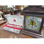 AN ANTIQUE STRIKING MANTLE CLOCK, AND BOXED DESSERT CUTLERY.