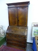 A GEORGIAN AND LATER OAK AND INLAID BUREAU BOOKCASE.