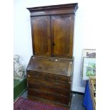 A GEORGIAN AND LATER OAK AND INLAID BUREAU BOOKCASE.