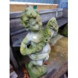 A CHERUB GARDEN FIGURE.