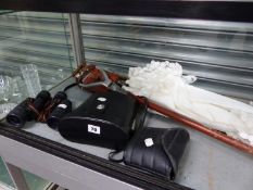 THREE PAIRS OF BINOCULARS, TWO SHOOTING STICKS AND A LACE TRIMMED PARASOL.
