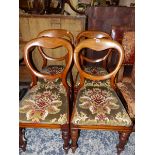 A SET OF FOUR VICTORIAN BALLOON BACK CHAIRS.