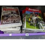 A QUANTITY OF MOTORCYCLE MAGAZINES.