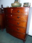 A 19TH CENTURY TALL MAHOGANY BOW FRONT CHEST OF TWO SHORT AND FOUR LONG GRADUATED DRAWERS 107 CM