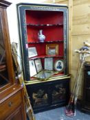 AN ANTIQUE EBONISED CHINOISERIE CORNER CABINET.