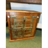 AN EASTERN IRON MOUNTED AND PAINTED SMALL RUSTIC CABINET