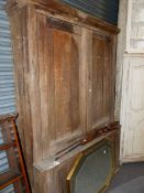 A 19th C. OAK ENCLOSED SHELVED CABINET.