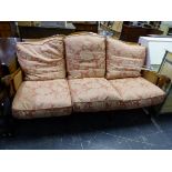 A LARGE BERGERE THREE SEAT SETTEE.
