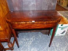 A LATE GEORGIAN MAHOGANY FOLD OVER TEA TABLE.