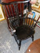 AN EBONIZED SPINDLE BACK ARMCHAIR.