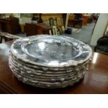 TEN SMALL ARMORIAL DECORATED SILVER PLATED PLATTERS.
