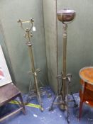 A NEAR PAIR OF BRASS OIL LAMP STANDARD LAMPS.