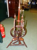 A 19th C. OAK SPINNING WHEEL WITH TREADLE TURNING TWELVE SPOKE WHEEL