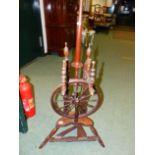 A 19th C. OAK SPINNING WHEEL WITH TREADLE TURNING TWELVE SPOKE WHEEL