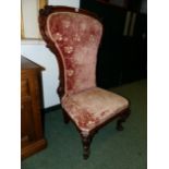 A VICTORIAN CARVED ROSEWOOD SHOWFRAME SLIPPER CHAIR