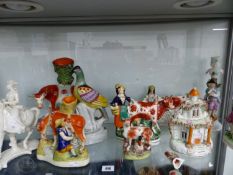 A QTY OF ANTIQUE AND OTHER STAFFORDSHIRE FLATBACK FIGURES, A NYMPHENBURG HORSE AND RIDER